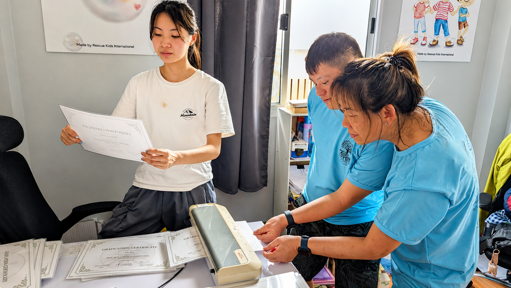 Team members preparing graduation certificates in a bright office